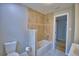 Bathroom featuring tiled shower and tub, plus modern fixtures at 1919 19Th Nw St, Winter Haven, FL 33881