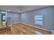 This bedroom has hardwood floors and a window with natural light, creating a bright and airy space at 1919 19Th Nw St, Winter Haven, FL 33881