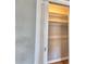 Bright closet with sliding louvered door and storage shelves at 1919 19Th Nw St, Winter Haven, FL 33881