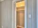 Bright closet with sliding louvered door and storage shelves at 1919 19Th Nw St, Winter Haven, FL 33881