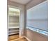 Bedroom view of closet with storage and natural light from a window at 1919 19Th Nw St, Winter Haven, FL 33881