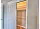 Open closet with sliding doors and bright lighting with shelves at 1919 19Th Nw St, Winter Haven, FL 33881