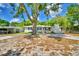 Charming single-story home with a large shade tree and inviting curb appeal at 1919 19Th Nw St, Winter Haven, FL 33881