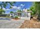 Charming single Gathering home with a painted brick exterior, well maintained lawn and a chimney at 1919 19Th Nw St, Winter Haven, FL 33881