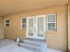 View of the exterior, featuring steps leading to a set of french doors at 1919 19Th Nw St, Winter Haven, FL 33881