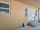 View of the exterior, featuring steps leading to a set of french doors at 1919 19Th Nw St, Winter Haven, FL 33881