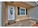 Close-up of the front door and porch with stylish design elements at 1919 19Th Nw St, Winter Haven, FL 33881