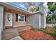 Charming front porch with well-manicured landscaping at 1919 19Th Nw St, Winter Haven, FL 33881