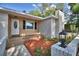 Charming front porch with well-manicured landscaping and modern lighting at 1919 19Th Nw St, Winter Haven, FL 33881