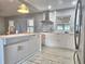 Modern kitchen features a farmhouse sink, marble backsplash, stainless steel appliances and ample storage space at 1919 19Th Nw St, Winter Haven, FL 33881