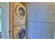 Laundry area featuring a stacked washer and dryer at 1919 19Th Nw St, Winter Haven, FL 33881