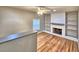 Bright living room with hardwood floors, fireplace, and built-in bookshelves at 1919 19Th Nw St, Winter Haven, FL 33881