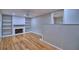 Cozy living room features a fireplace with white brick surround and built-in shelving on either side at 1919 19Th Nw St, Winter Haven, FL 33881
