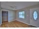 Bright living room with hardwood floors, a ceiling fan, and ample natural light at 1919 19Th Nw St, Winter Haven, FL 33881