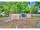 Spacious storage shed with double doors and a single pane window, perfect for housing tools and equipment at 1919 19Th Nw St, Winter Haven, FL 33881