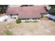 An aerial view of a single-story house with a well-maintained roof, greenery, and a surrounding yard at 211 Pierce St, Lake Wales, FL 33859
