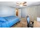 Bright bedroom offering a ceiling fan, closet, and a view into another room, providing an open feel at 211 Pierce St, Lake Wales, FL 33859