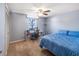 Bedroom boasts a ceiling fan, natural light, ample closet space, and a calming blue color scheme at 211 Pierce St, Lake Wales, FL 33859