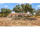 Charming one-story home featuring a spacious yard and beautiful mature trees providing ample shade at 211 Pierce St, Lake Wales, FL 33859