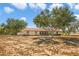 Charming one-story home featuring a spacious yard and beautiful mature trees providing ample shade at 211 Pierce St, Lake Wales, FL 33859