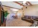 Spacious, open-concept living room showcasing natural beams and an adjacent dining area at 211 Pierce St, Lake Wales, FL 33859