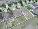 Aerial view of properties with fenced backyards in a well-maintained neighborhood at 213 Tanager St, Haines City, FL 33844