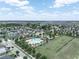 An aerial view showcasing community amenities including the pool and playground at 213 Tanager St, Haines City, FL 33844