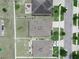 Aerial view of a backyard featuring a patio, landscaping, and well-maintained lawn at 213 Tanager St, Haines City, FL 33844