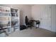 Bedroom featuring a desk, chair, bookshelf, and door at 213 Tanager St, Haines City, FL 33844