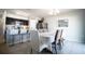 Dining room with barstool seating at a kitchen island and modern overhead lighting at 213 Tanager St, Haines City, FL 33844