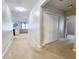Hallway leading into the living room with access to a closet and doorways at 213 Tanager St, Haines City, FL 33844