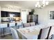 Bright kitchen and dining area with granite countertops, stainless steel appliances and modern finishes at 213 Tanager St, Haines City, FL 33844