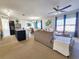 Open-concept living space with kitchen, dining, and living areas filled with natural light at 213 Tanager St, Haines City, FL 33844