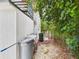 Backyard features a laundry sink, utility storage, and space ready to be landscaped at 2222 12Th Nw St, Winter Haven, FL 33881