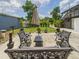 Backyard patio with seating, an umbrella, and a grill, perfect for outdoor entertaining at 2222 12Th Nw St, Winter Haven, FL 33881