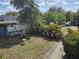 Backyard with a small bird bath and perimeter vegetation at 2222 12Th Nw St, Winter Haven, FL 33881