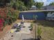Inviting backyard retreat with patio, seating, vibrant flowers, and lush greenery at 2222 12Th Nw St, Winter Haven, FL 33881