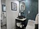 Stylish bathroom features a vessel sink, modern fixtures, and elegant wall decor at 2222 12Th Nw St, Winter Haven, FL 33881
