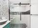 Beautiful bathroom featuring a modern shower with stone pebble flooring and decorative tiling at 2222 12Th Nw St, Winter Haven, FL 33881