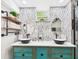 Bright bathroom has a double vanity, decorative mirrors, and a walk in shower at 2222 12Th Nw St, Winter Haven, FL 33881