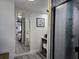 Updated bathroom with modern fixtures and a frameless glass-enclosed shower stall at 2222 12Th Nw St, Winter Haven, FL 33881