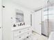 Well-lit bathroom featuring a modern vanity, framed mirror, and an elegant faucet at 2222 12Th Nw St, Winter Haven, FL 33881