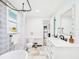 Clean bathroom featuring a clawfoot tub, toilet, modern sink, and direct access to the kitchen at 2222 12Th Nw St, Winter Haven, FL 33881