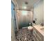 Stylish bathroom featuring decorative tile flooring and updated fixtures at 2222 12Th Nw St, Winter Haven, FL 33881
