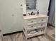 Bright bathroom featuring a white vanity with marble countertops and updated fixtures at 2222 12Th Nw St, Winter Haven, FL 33881