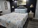 Inviting bedroom featuring stylish bedspread and coordinated nightstands at 2222 12Th Nw St, Winter Haven, FL 33881