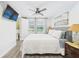 Comfortable bedroom with a bed, TV, and neutral decor at 2222 12Th Nw St, Winter Haven, FL 33881