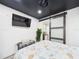 Cozy bedroom with a large bed, TV, and a sliding barn door leading to another room at 2222 12Th Nw St, Winter Haven, FL 33881