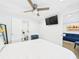 Bright bedroom with a bed, ceiling fan, and ensuite bathroom at 2222 12Th Nw St, Winter Haven, FL 33881
