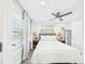 Bright bedroom featuring a comfortable bed, ceiling fan, and ample natural light at 2222 12Th Nw St, Winter Haven, FL 33881